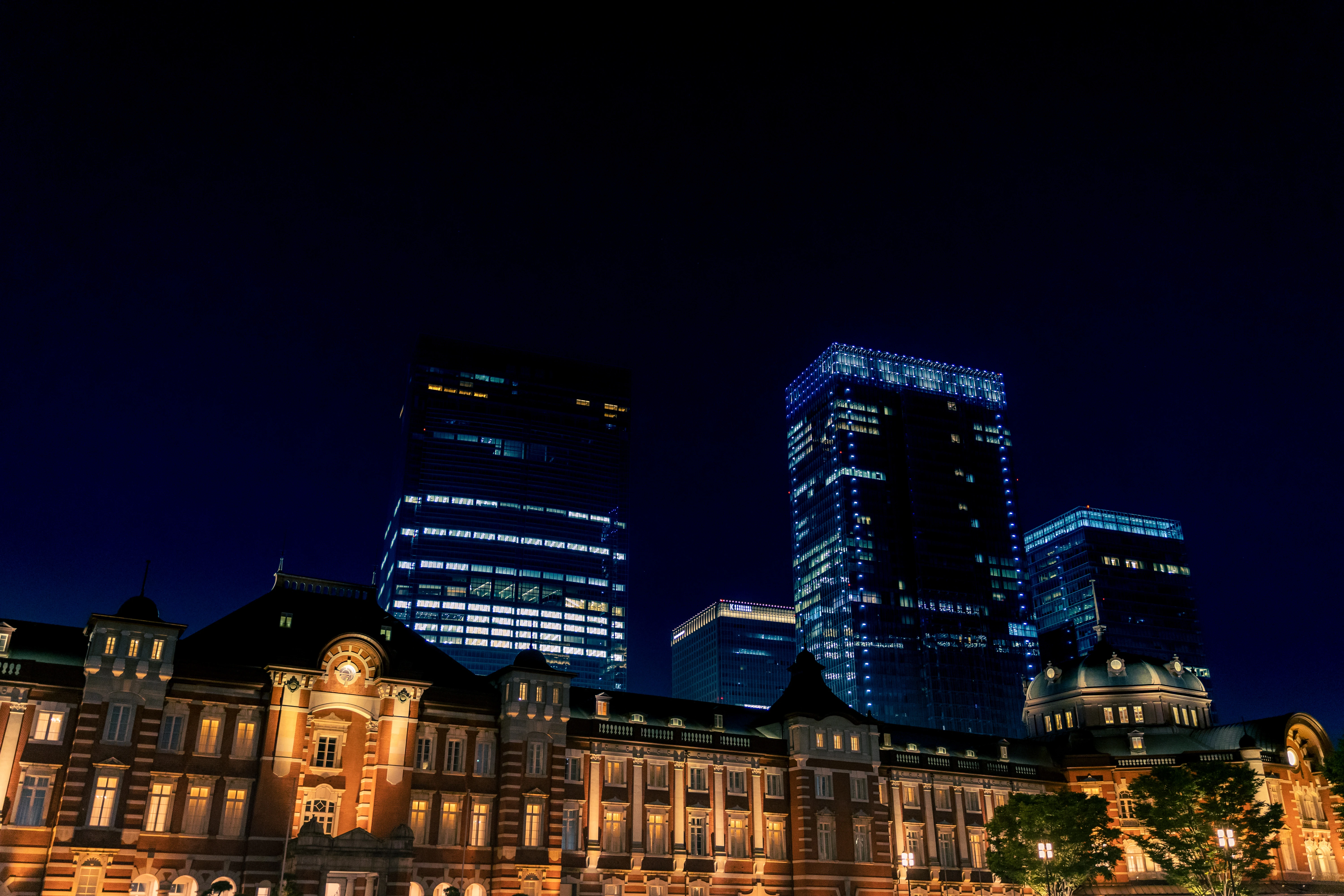 Nighttime Elegance of Tokyo Station and Modern Skyscrapers